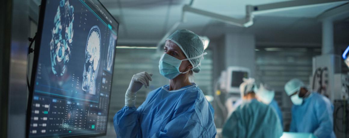 doctor looking at display before medical procedure